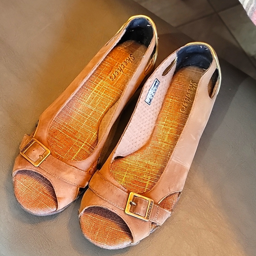 TAN Skechers open toed shoes.